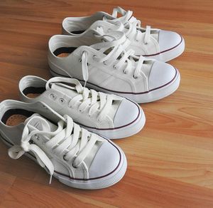 Close-up of athletic shoes on a clean floor.